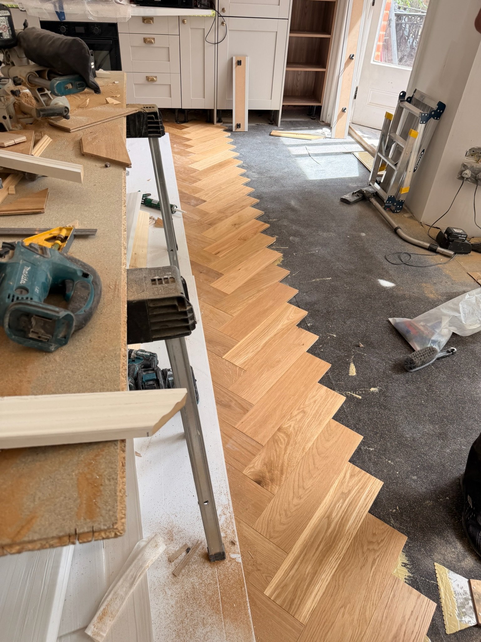 Bayocorp herringbone flooring installation in progress