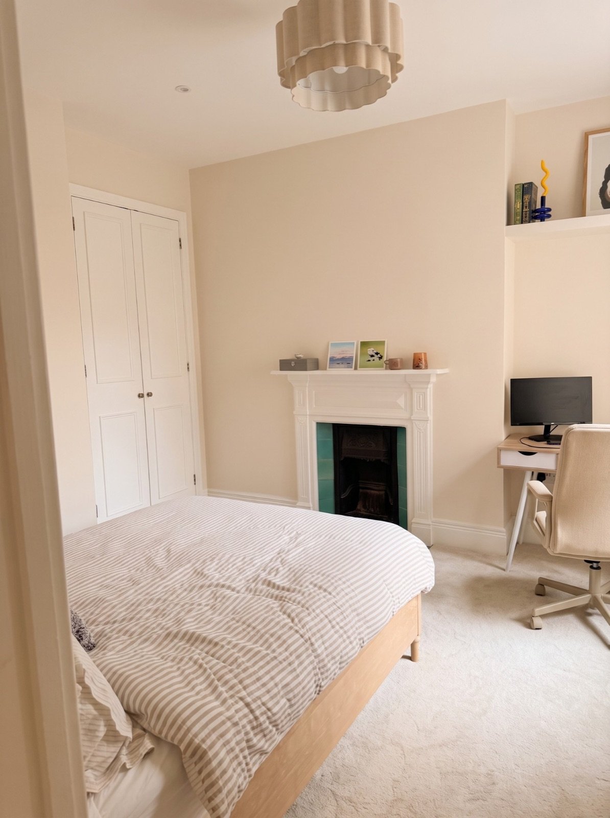 Second bedroom with fitted alcove cupboard, fireplace and floating shelf