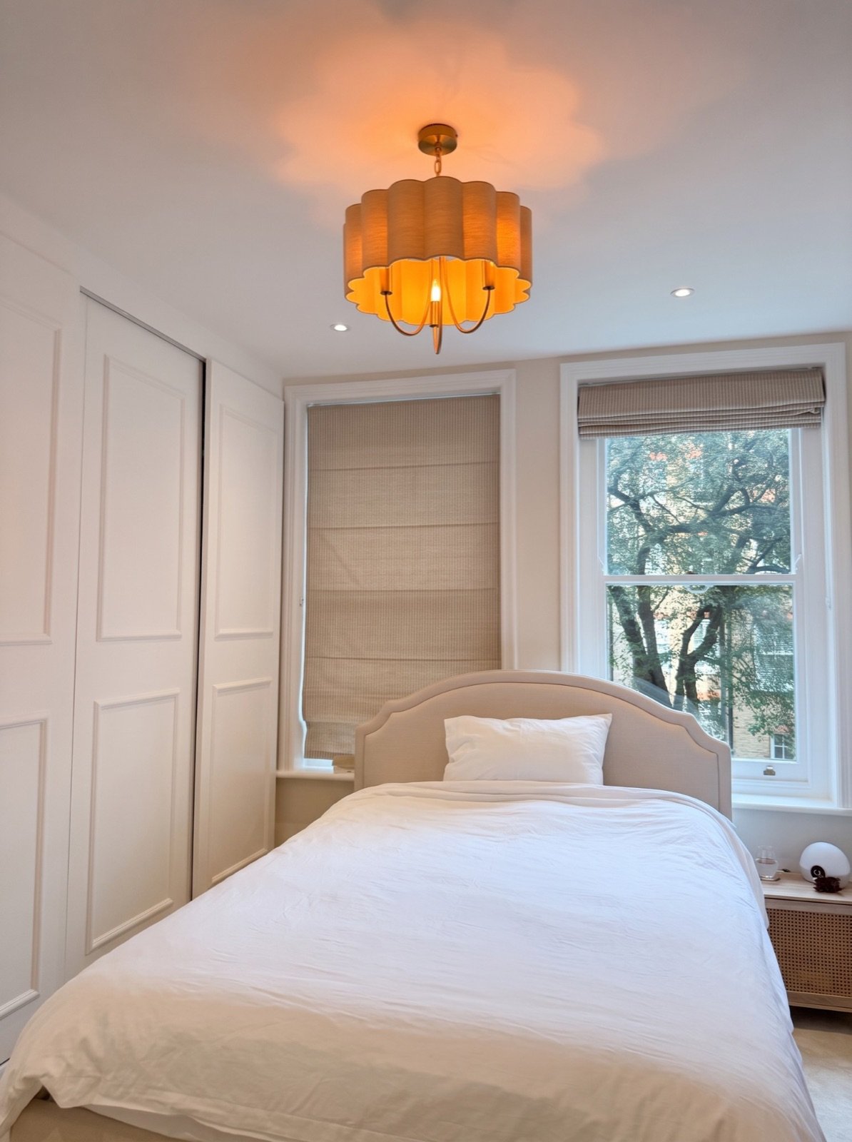 Main bedroom with sliding panelled wardrobe, downlights and restored sash windows