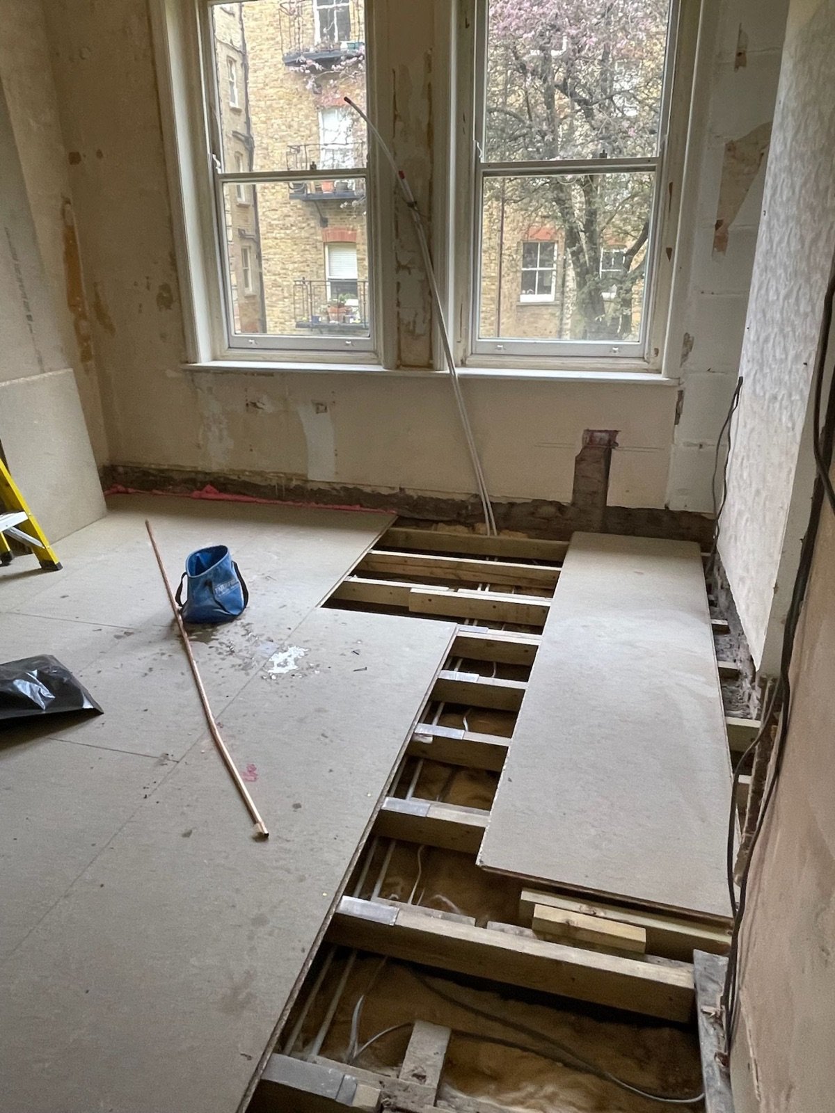 Floor joists levelled with new chipboard flooring being installed